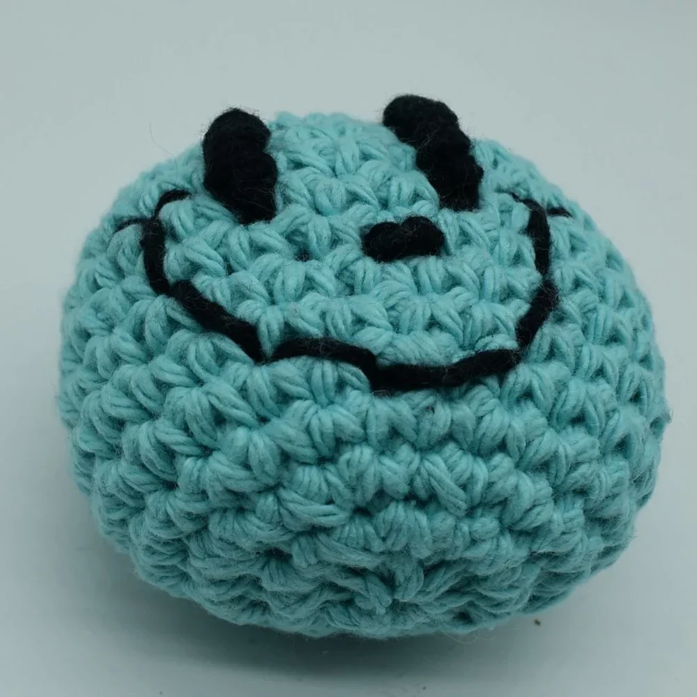 Handcrafted crochet catnip happy face cat toy
